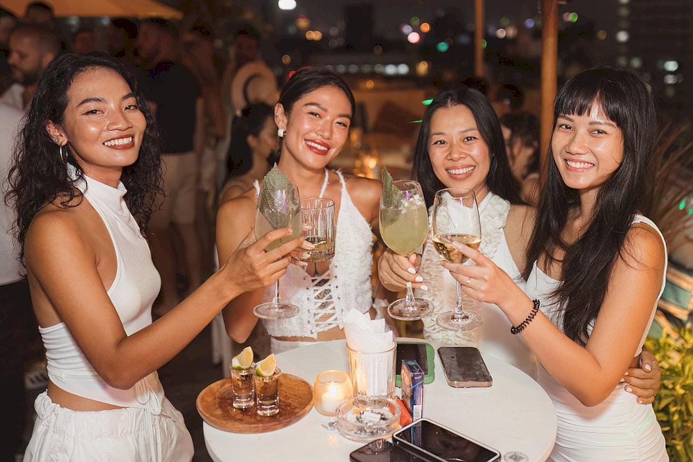 A lively drink table loaded with colorful cocktails